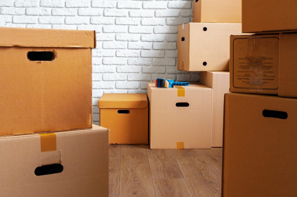 Close up of moving carton boxes in an empty room